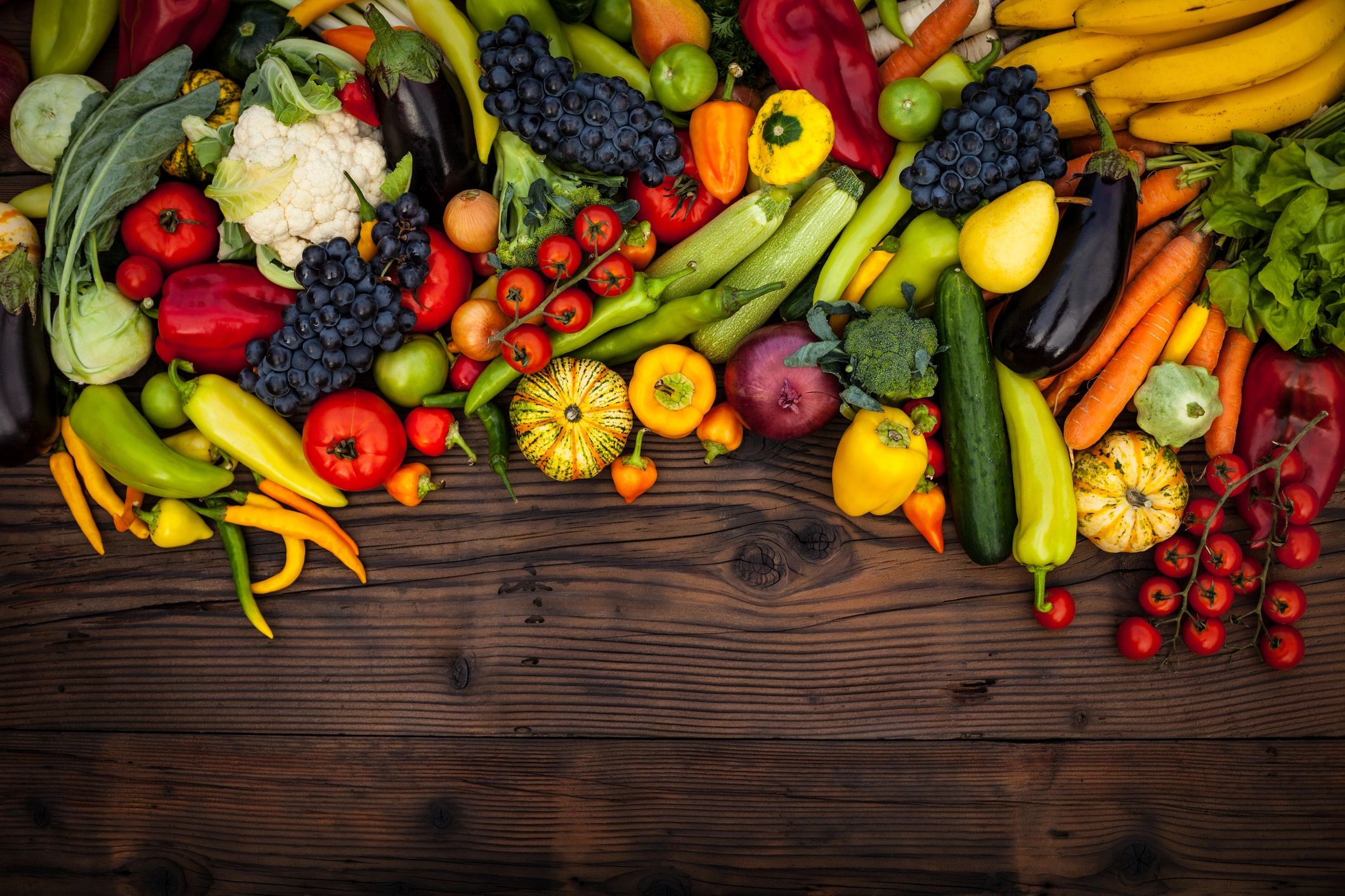 Assorted fruits and vegetables on a wooden table